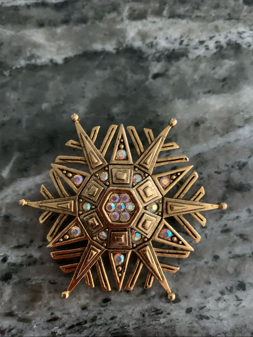 Gold-Tone Starburst Brooch with Radial Spokes